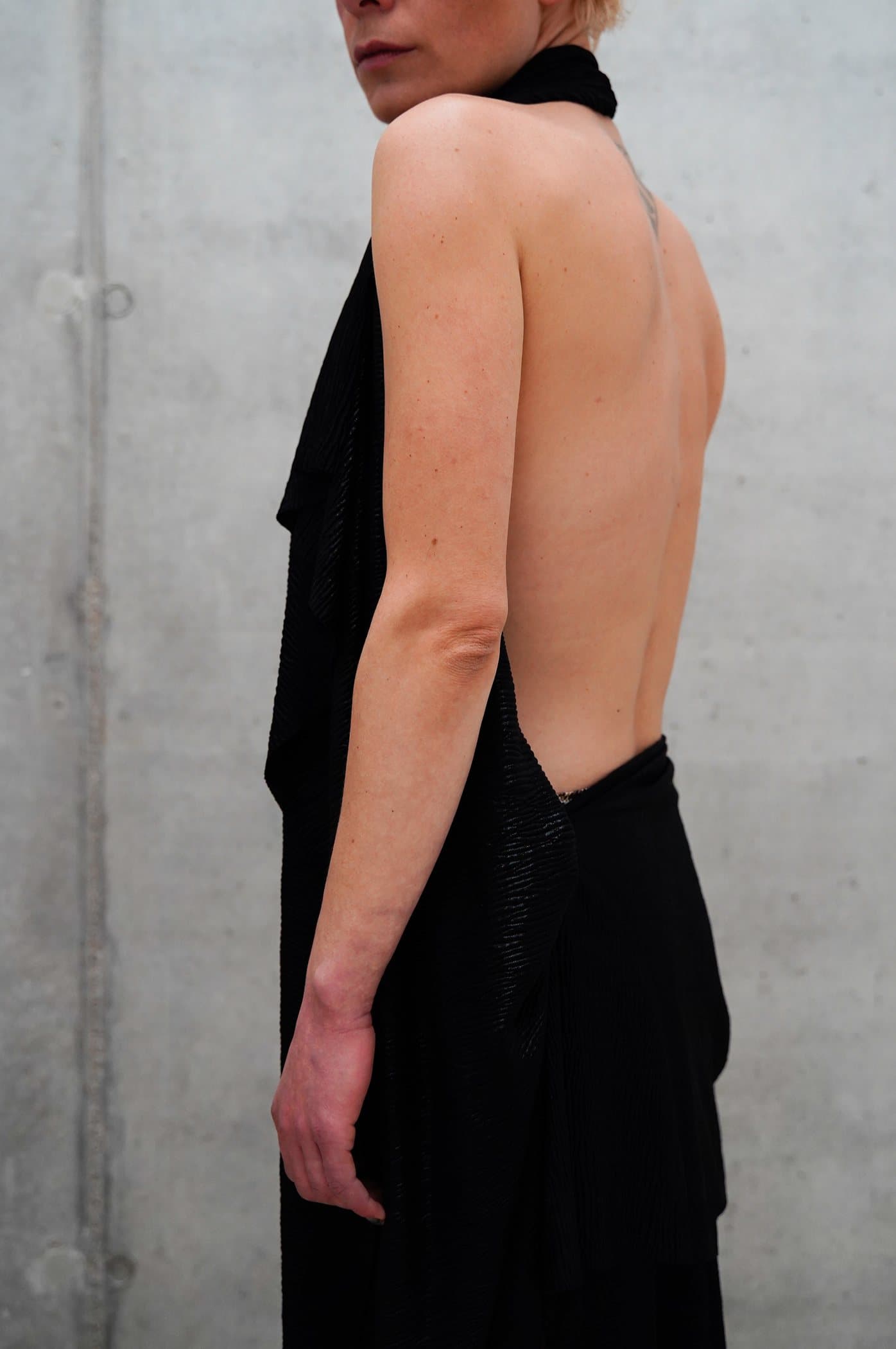 Black halter gown with a deep open back