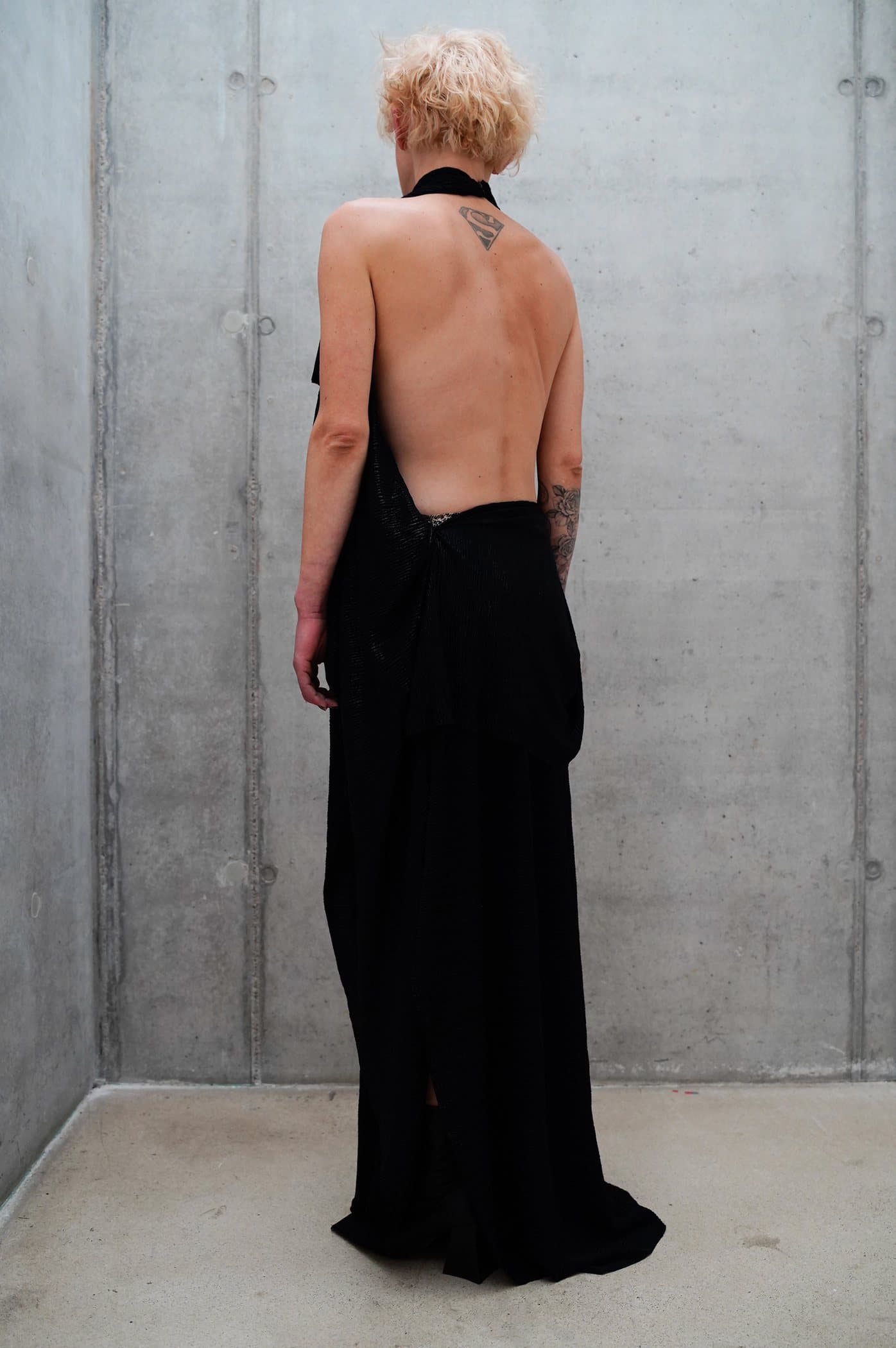 Black halter gown with a deep open back